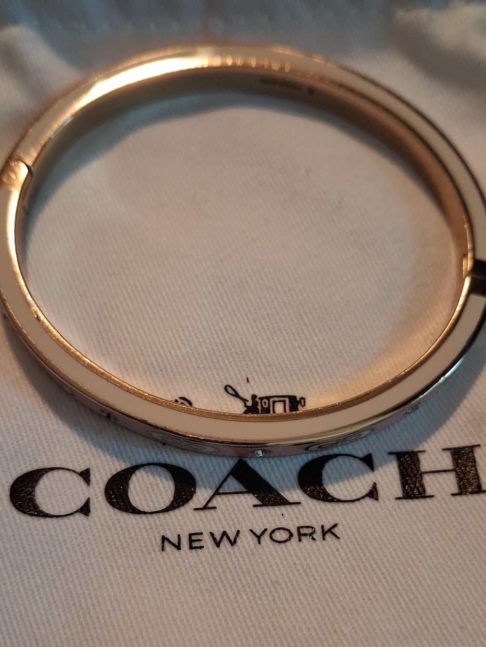 Coach gold Plated and Pink Cc Bracelet.
